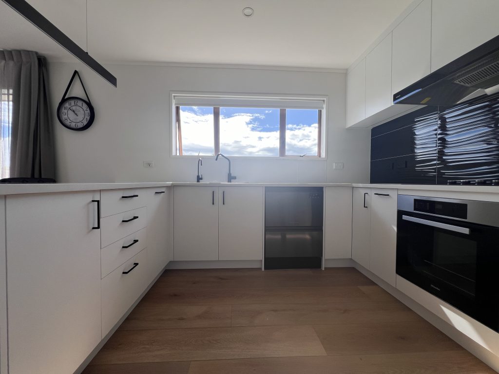 a U-shaped Achromatic black and white Kitchen Design Auckland