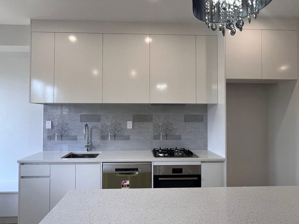 Modern white open plan kitchen Auckland