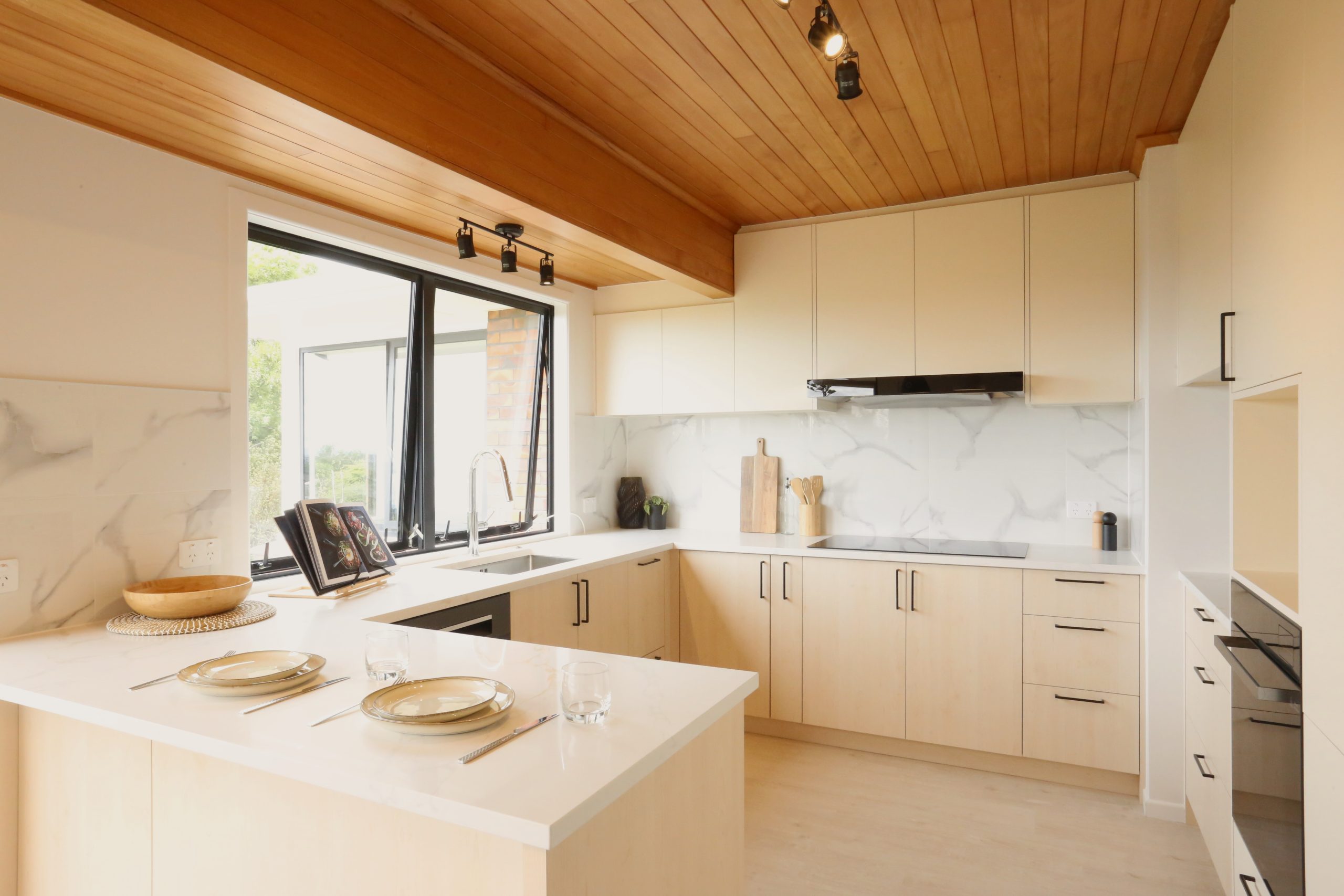 Warm woodgrain open plan kitchen renovation Auckland