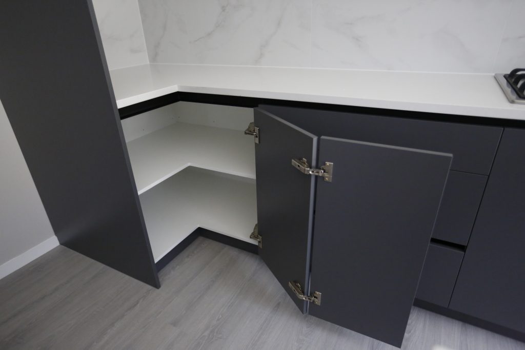 A Fully Handleless Sleek Minimalist black and white Kitchen Auckland